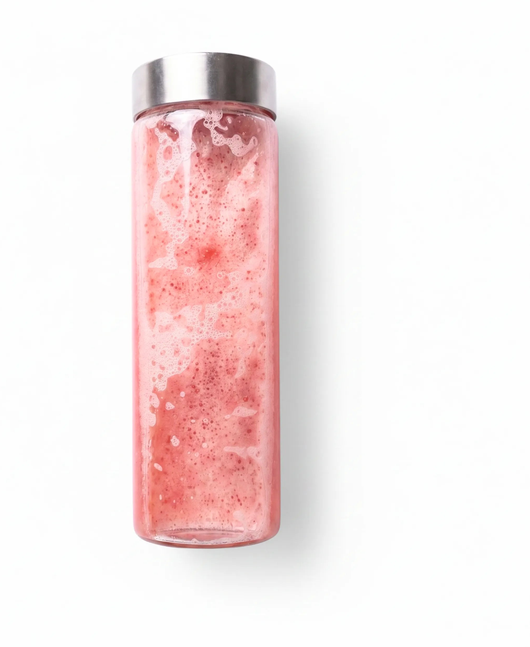 A clear cylindrical bottle with a brushed silver metal cap, filled with a pink frothy beverage, shown against a plain white background.